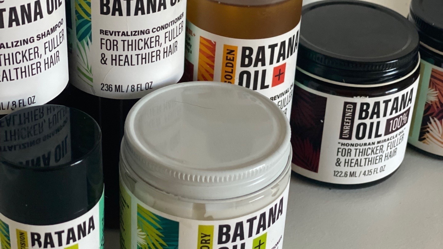 Hotana batana oil jars and bottles showing full product range
