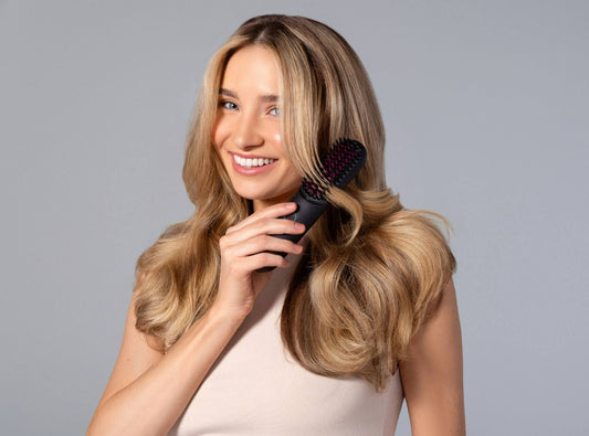 Woman brushing her hair 